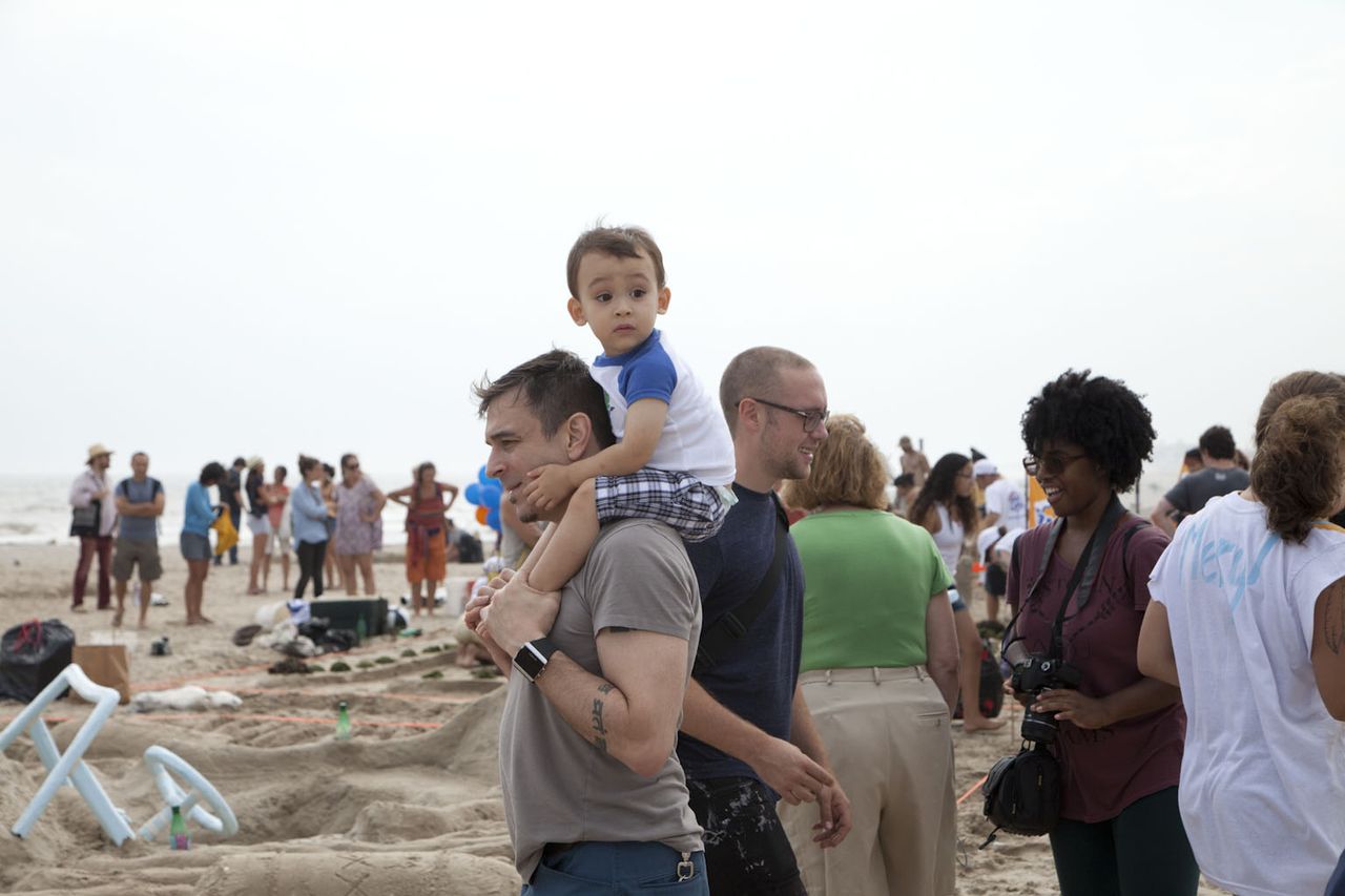 Visitors to a sandcastle competition on Rockaway Beach, summer 2013. (Photo: Jessica Bruah)